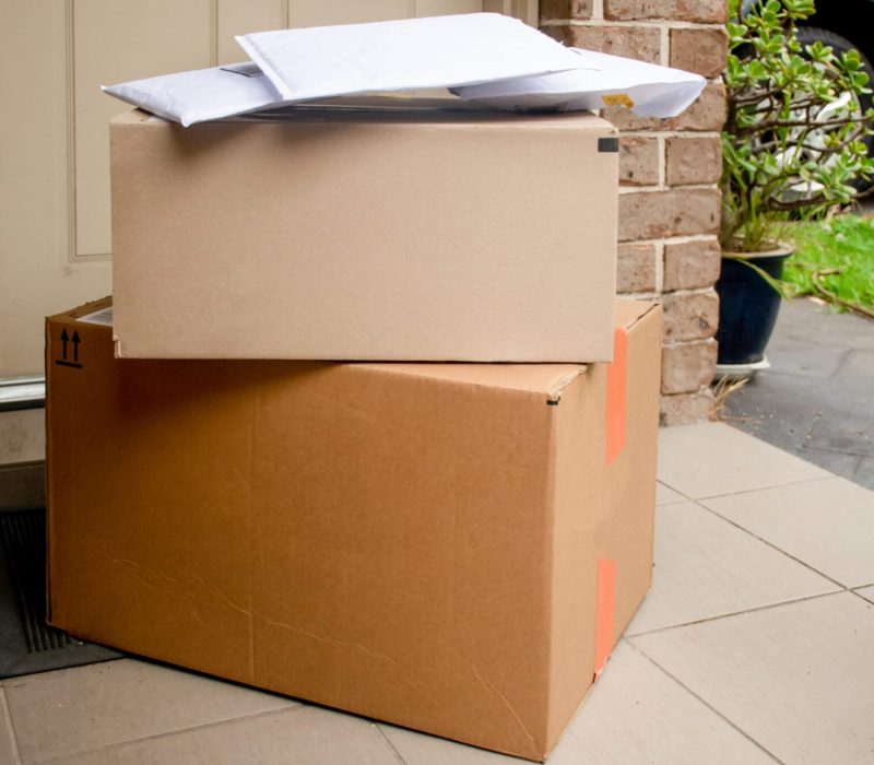 boxes-and-envelopes-delivered-to-a-front-door-porc-2025-01-08-02-26-06-utc
