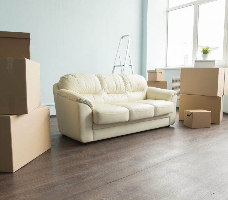 Empty room full of cardboard boxes for moving into a new home